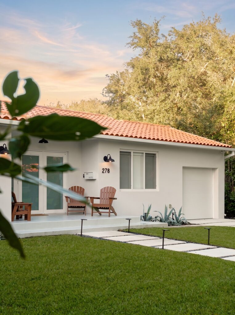 1_Frontyard_Shot_3_F Miami Shores Residence front elevation with tropical landscaping — Duoma Atelier
