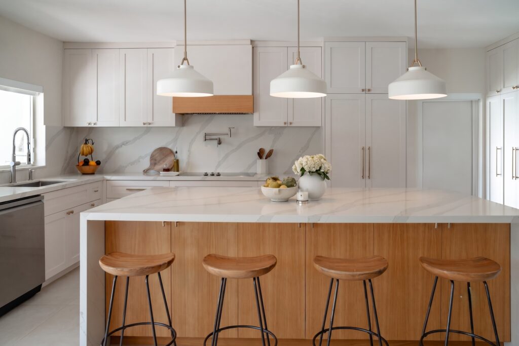 4_Kitchen_Shot_2_F Miami Shores Residence kitchen with marble backsplash, brass pendants and white oak island — Duoma Atelier