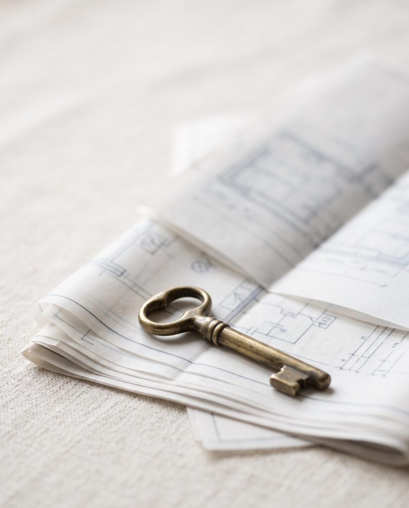 Villa keys resting on architectural drawings at the close of an Italian renovation project